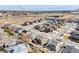 Aerial view of a home in a residential area with surrounding houses and a patio at 187 Cerillos St, Brighton, CO 80601