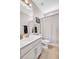 Clean bathroom featuring modern fixtures, vanity with storage, and a shower with curtain at 187 Cerillos St, Brighton, CO 80601