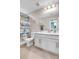 bathroom with tub, toilet and a white vanity featuring gold hardware at 187 Cerillos St, Brighton, CO 80601