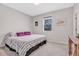 Cozy bedroom with plush carpeting, natural light from the window, and a comfortable queen size bed at 187 Cerillos St, Brighton, CO 80601