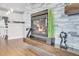 Modern fireplace with stone accents and a wooden mantle, adding warmth to the living space at 187 Cerillos St, Brighton, CO 80601