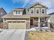Charming two-story home with a well-maintained front yard and a two-car garage at 187 Cerillos St, Brighton, CO 80601