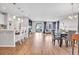 Spacious living area featuring a dining area, kitchen with a breakfast bar, and cozy Gathering room at 187 Cerillos St, Brighton, CO 80601