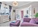 Bright sitting room with French doors, plush seating, and a decorative chandelier at 187 Cerillos St, Brighton, CO 80601