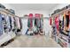 Well-organized walk-in closet with hanging racks and storage shelves at 187 Cerillos St, Brighton, CO 80601