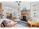 Bright living room with fireplace, built-ins, and hardwood floors at 1529 E 22Nd Ave, Denver, CO 80205