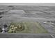Aerial shot of a well-maintained home on a large lot, showcasing its beautiful surroundings and proximity to open land at 7409 S County Road 157, Strasburg, CO 80136