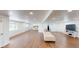 Spacious basement featuring wood-look floors, recessed lighting, and ample space for recreation and relaxation at 7409 S County Road 157, Strasburg, CO 80136