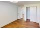 Bedroom with wood floors and closet at 7409 S County Road 157, Strasburg, CO 80136