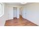 Bright bedroom with wood floors, closet, and natural light at 7409 S County Road 157, Strasburg, CO 80136