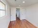 Bedroom with wood floors and closet at 7409 S County Road 157, Strasburg, CO 80136