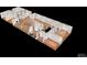 AI generated 3D floor plan of a home featuring wood floors, white walls, many windows, and a central fireplace at 7409 S County Road 157, Strasburg, CO 80136