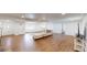 Bright living room with wood floors, recessed lighting, and neutral paint at 7409 S County Road 157, Strasburg, CO 80136