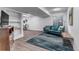 Finished basement with a cozy seating area and a decorative rug at 7132 Eagle Rock Dr, Littleton, CO 80125