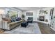 Bright living room featuring a fireplace, a large window, and comfortable seating at 7132 Eagle Rock Dr, Littleton, CO 80125