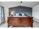 Charming main bedroom with wood floors, paneled accent wall, and a sleigh bed at 7132 Eagle Rock Dr, Littleton, CO 80125