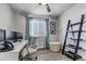 Inviting office with sleek white desk, modern decor, and a comfortable workspace at 7132 Eagle Rock Dr, Littleton, CO 80125