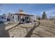 Large backyard featuring patio, outdoor seating, and landscaping at 7160 S Jellison St, Littleton, CO 80128