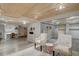 Finished basement with ample space, seating, and room for activities at 7160 S Jellison St, Littleton, CO 80128
