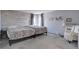 Bright bedroom featuring two beds, neutral decor, and plenty of natural light for a relaxing and comfortable ambiance at 7160 S Jellison St, Littleton, CO 80128