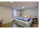 Finished basement bedroom with good light, furniture and a small closet at 7160 S Jellison St, Littleton, CO 80128