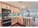 Modern kitchen with stainless steel appliances and island at 624 Pearl St # 301, Boulder, CO 80302