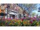 Bustling street with shops and flowers in bloom at 624 Pearl St # 301, Boulder, CO 80302