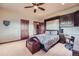 Bedroom with a Murphy bed, a built-in desk, ample storage, and neutral wall paint at 401 Raptor Point Rd, Golden, CO 80403