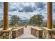 An outdoor fire pit with stone seating creates a cozy gathering spot with breathtaking views at 401 Raptor Point Rd, Golden, CO 80403