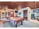 Game room showcasing a pool table with a decorative copper-colored ceiling and unique lighting at 401 Raptor Point Rd, Golden, CO 80403