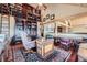 Spacious home office with high ceilings, a desk, a plush chair, and built-in bookshelves at 401 Raptor Point Rd, Golden, CO 80403