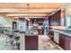 Modern kitchen with stainless steel appliances, granite countertops, and breakfast bar seating at 401 Raptor Point Rd, Golden, CO 80403