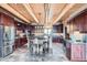Modern kitchen with dark wood cabinets, stainless steel appliances, and a center island with bar seating at 401 Raptor Point Rd, Golden, CO 80403