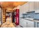 Well-appointed laundry room features modern appliances, ample cabinet space, and tile flooring at 401 Raptor Point Rd, Golden, CO 80403