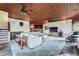 Open-concept living room with a decorative ceiling, comfortable furnishings, and a view into the kitchen at 401 Raptor Point Rd, Golden, CO 80403