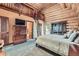 Lofted log cabin main bedroom featuring a ladder to an upper sleeping area at 401 Raptor Point Rd, Golden, CO 80403