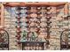 Charming wine cellar featuring stone walls, wooden racks displaying wine, and a table with glasses at 401 Raptor Point Rd, Golden, CO 80403