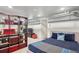 Cozy finished basement with built-in shelving, entertainment area, and comfortable seating at 2201 Cherry St, Denver, CO 80207