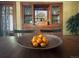 Dining room with a built-in hutch, a wooden table with seating, and a decorative bowl of oranges at 2201 Cherry St, Denver, CO 80207
