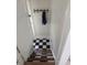 Entryway featuring wooden stairs and black and white checkered tile at 2201 Cherry St, Denver, CO 80207
