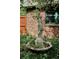 Elegant garden statue with a water feature and lush greenery at 2201 Cherry St, Denver, CO 80207
