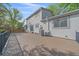 Backyard showing exterior of the home with a spacious deck at 18263 E Mansfield Ave, Aurora, CO 80013