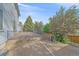Backyard with deck, railing, and landscaping at 18263 E Mansfield Ave, Aurora, CO 80013