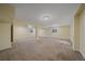 Open basement offering ample living space with carpet and natural light at 18263 E Mansfield Ave, Aurora, CO 80013