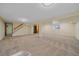 Large basement featuring carpet, support beams, and natural light at 18263 E Mansfield Ave, Aurora, CO 80013