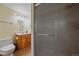 Well-lit bathroom with tiled floor, vanity, and shower stall at 18263 E Mansfield Ave, Aurora, CO 80013