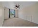 A spacious bedroom featuring a ceiling fan and natural light at 18263 E Mansfield Ave, Aurora, CO 80013