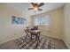 Bright bedroom featuring a desk and neutral decor at 18263 E Mansfield Ave, Aurora, CO 80013