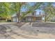 Charming two-story home with a well-maintained lawn, mature trees, and a two-car garage at 18263 E Mansfield Ave, Aurora, CO 80013