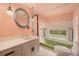 Retro bathroom with vintage fixtures and a window overlooking the outdoors at 22453 Hillcrest Cir, Golden, CO 80401